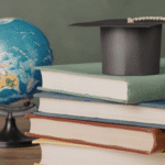 Some books with graduation cap and a world globe